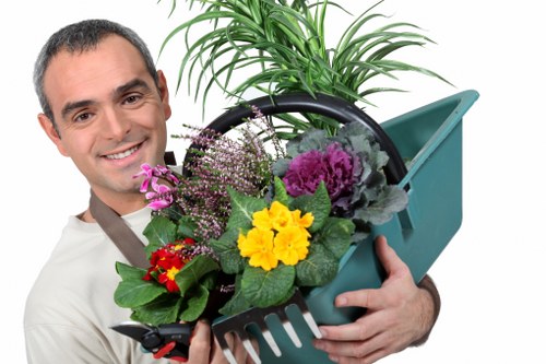 Team member inspecting gardening equipment before use